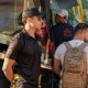 MotoGP travel group boarding shuttle bus with guide