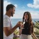 Couple enjoying hotel balcony view during MotoGP trip